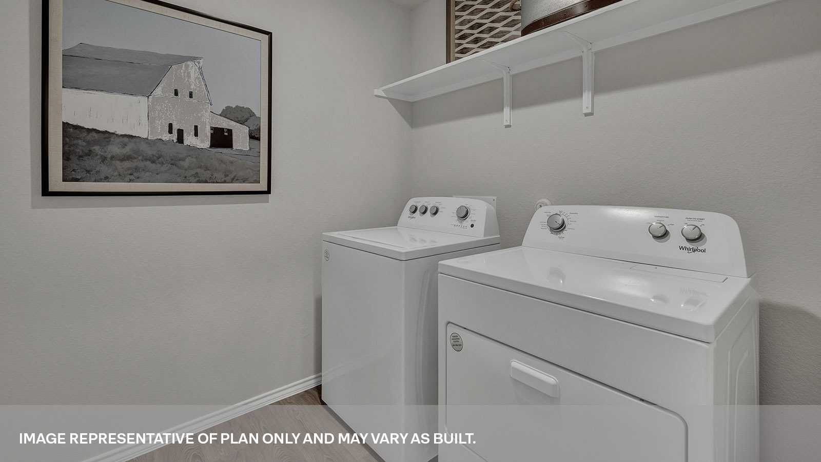 Laundry room with a wood shelf and washer/dryer connections.