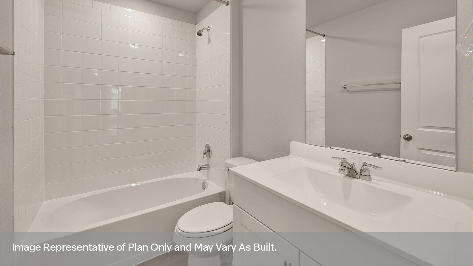 Hall bathroom with single sink vanity, toilet, and tub.