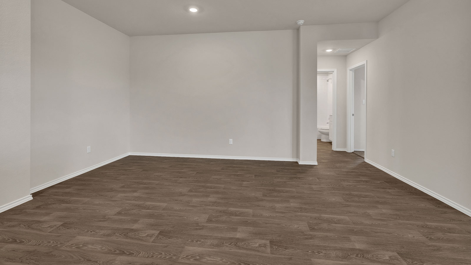 Dining with vinyl flooring and entry hallway.