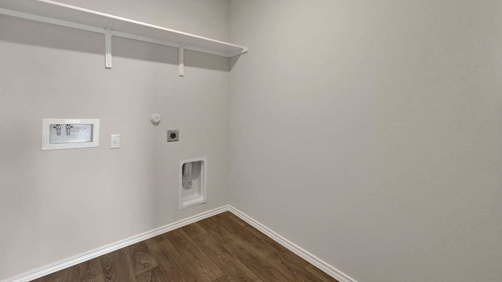 Laundry room washer/dryer connections.