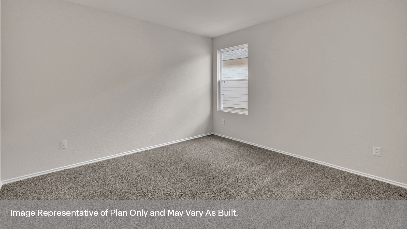 Front bedroom with carpeting and two windows.