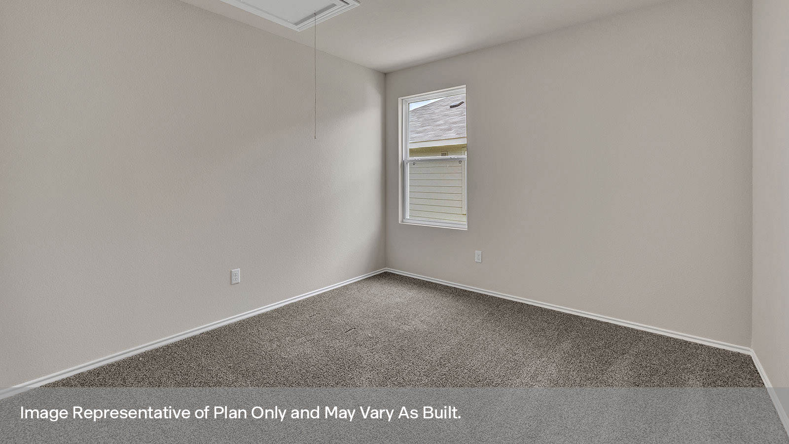 Bedroom with carpeting and one window looking into the side yard.