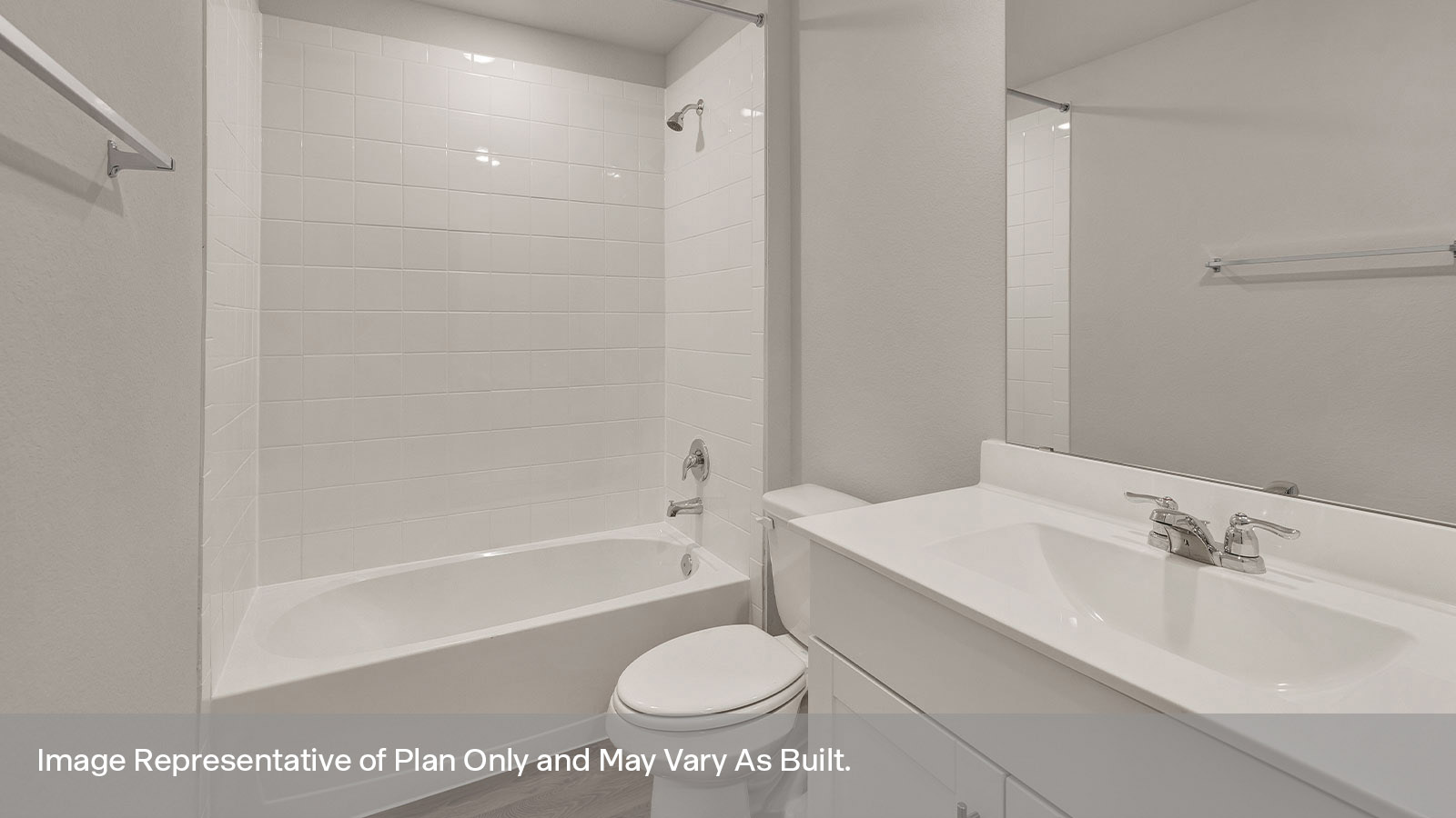 Hall bathroom with single sink vanity, toilet, and tub.