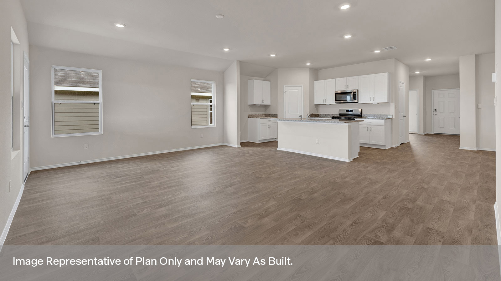Living room with vinyl flooring opening to the main bedroom.