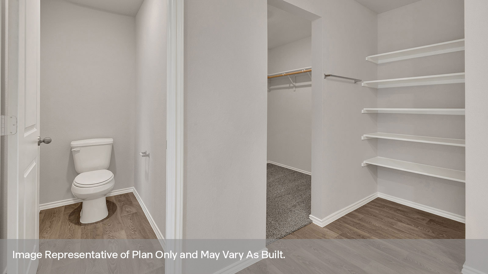 Main bedroom with carpeting and wooden shelving.