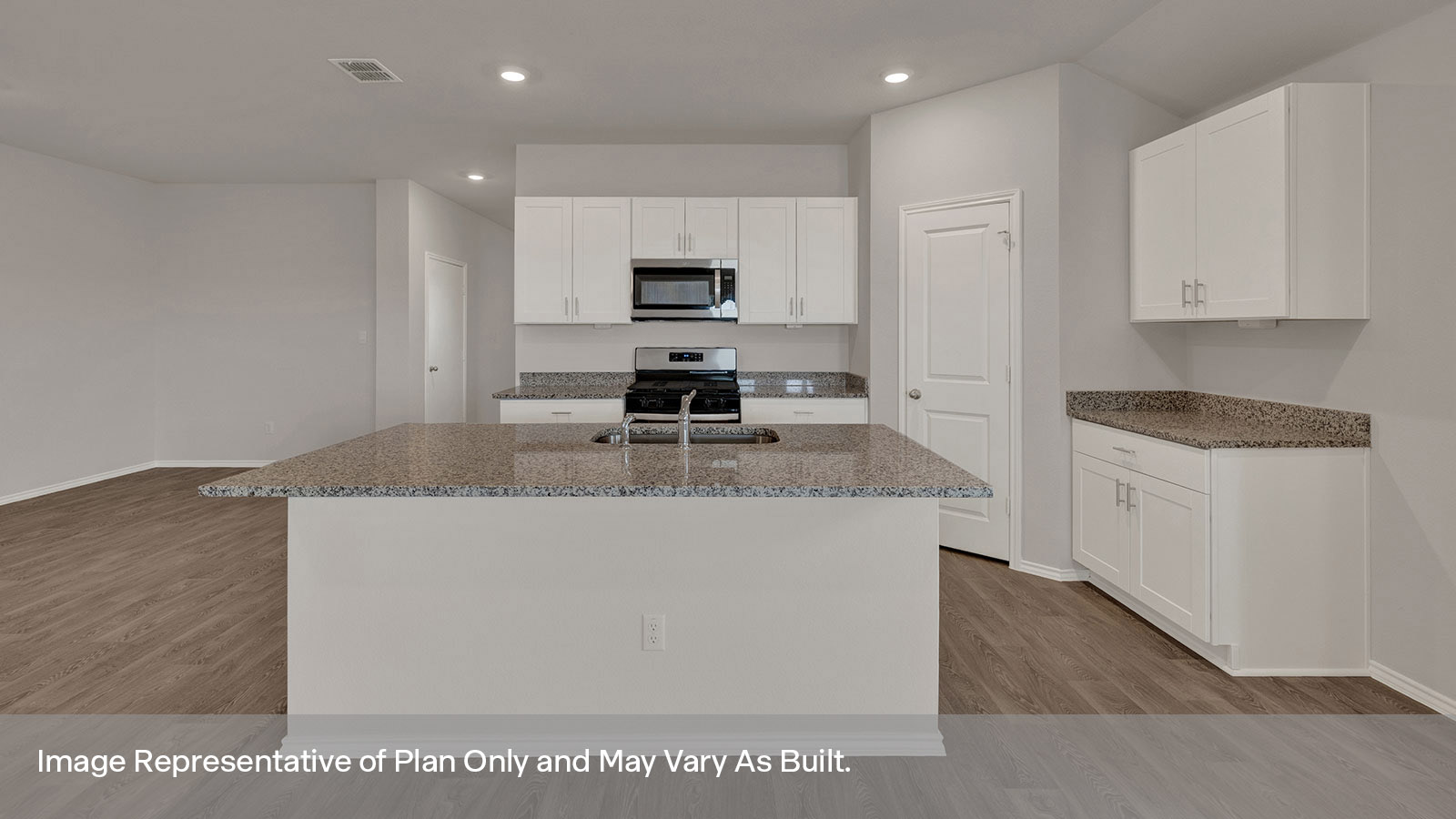 Dining room with vinyl flooring and entry hallway.