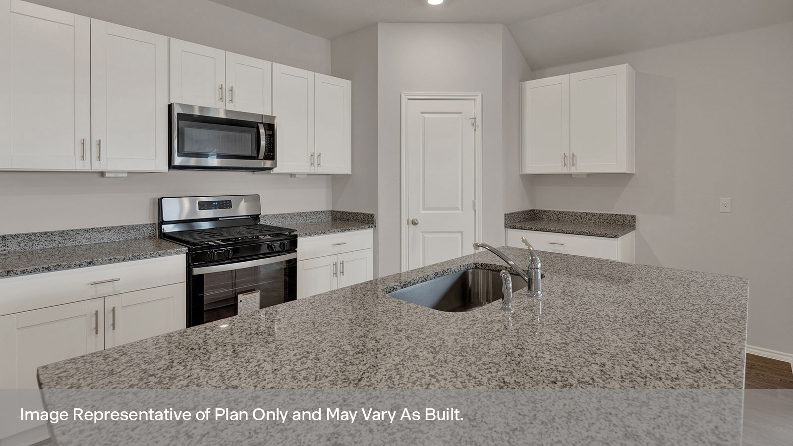 Kitchen with kitchen island and kitchen sink.