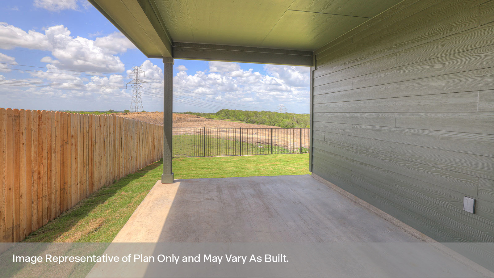 Covered back patio with privacy fence.