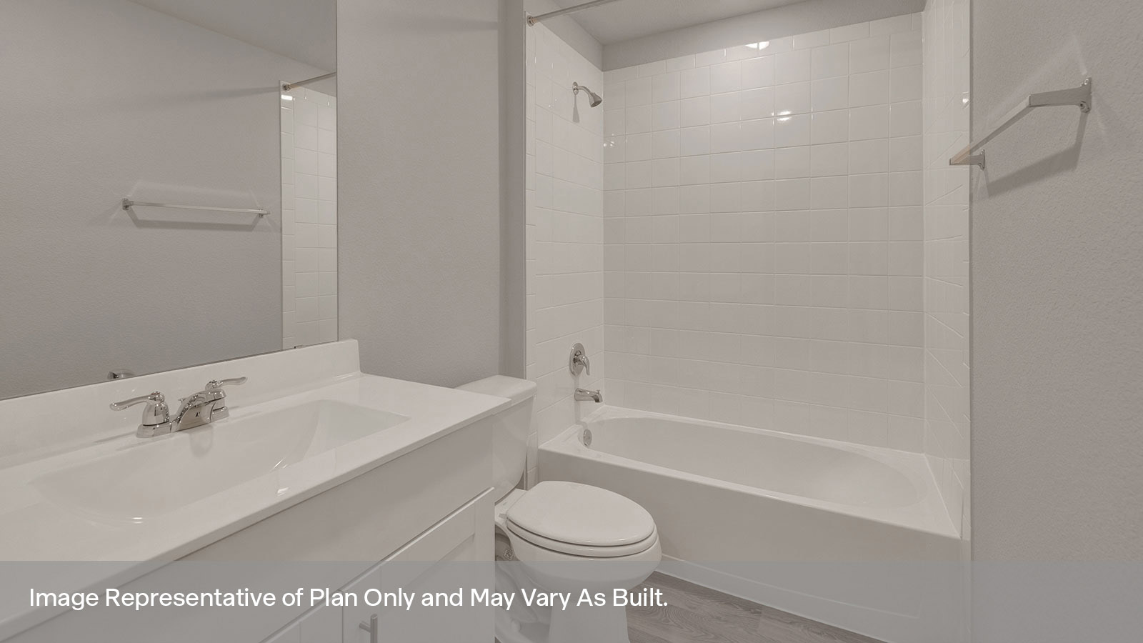 Bathroom with a tile surround shower/tub combo, single sink, under sink white cabinets.