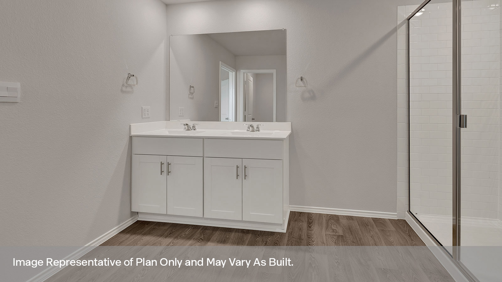 Main bathroom with a walk-in shower and a double sink.