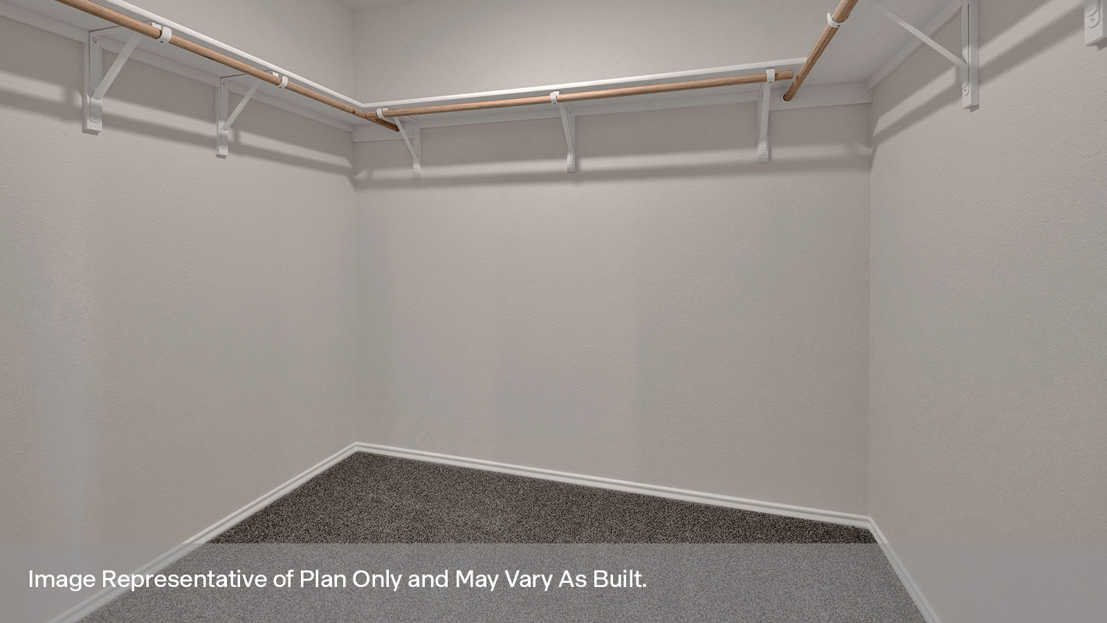 Walk-in closet with wooden shelves.