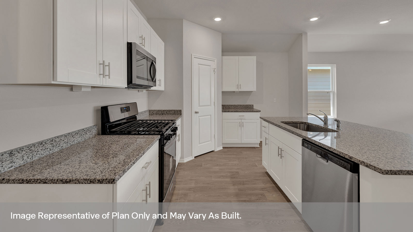 Kitchen with kitchen island and white cabinets.
