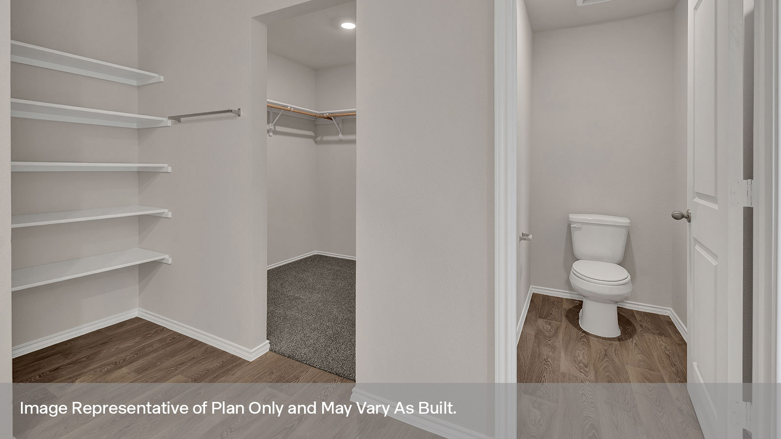 Main bathroom with water closet and closet entrance.