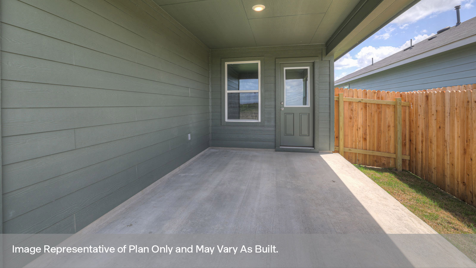 Covered back patio with privacy fence.