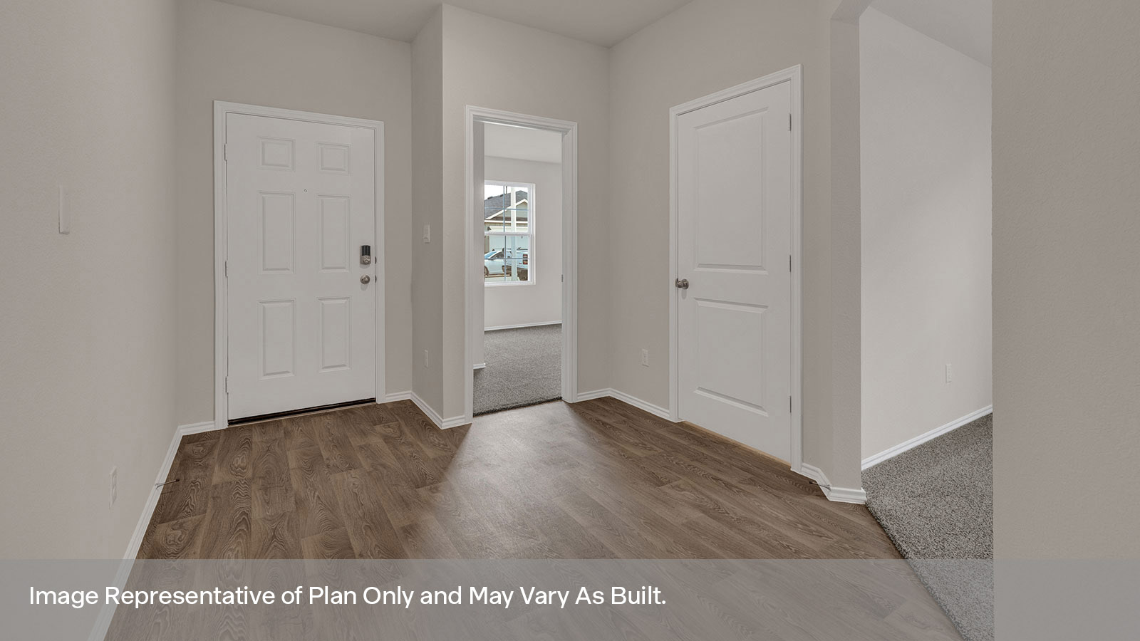 Entry hallway with vinyl flooring and front door.
