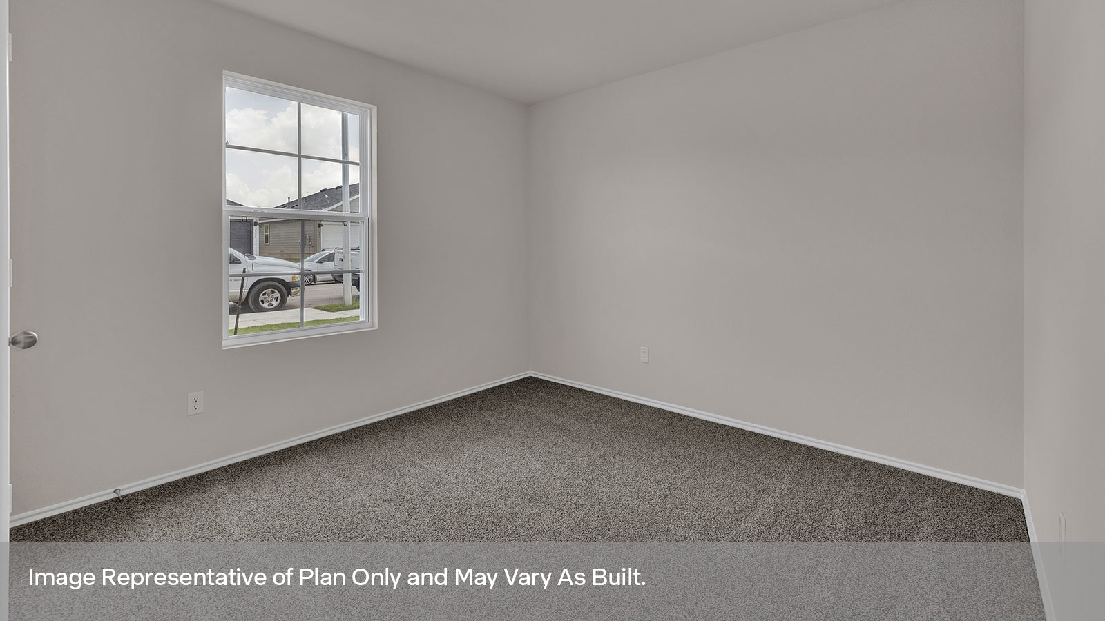 Front bedroom with carpeting and two windows.