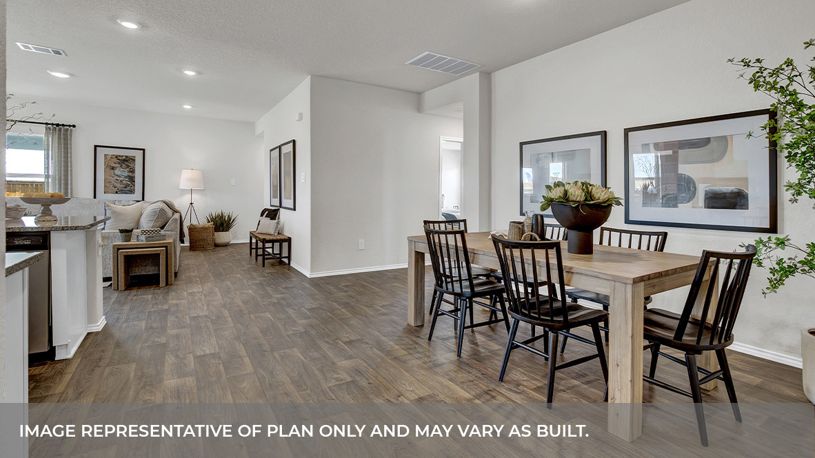 Dining room with vinyl flooring and entry hallway.