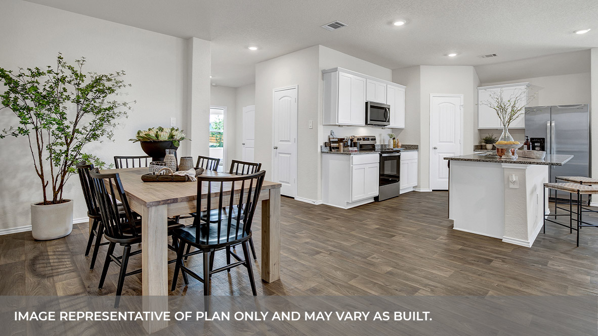 Dining room with vinyl flooring and entry hallway.
