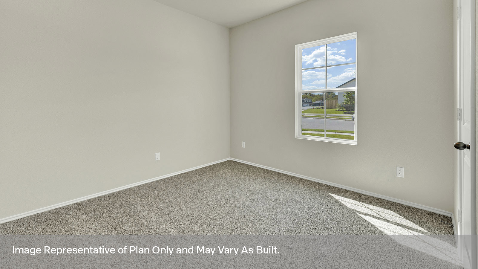 Front bedroom with carpeting and two windows.