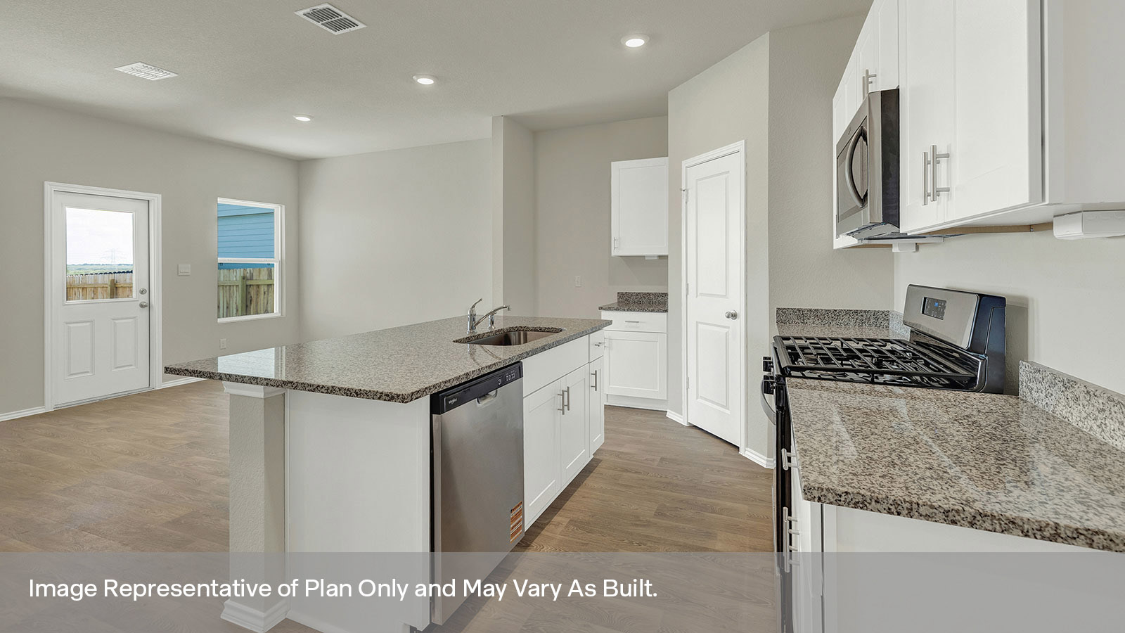 Kitchen with kitchen island and quartz countertops.