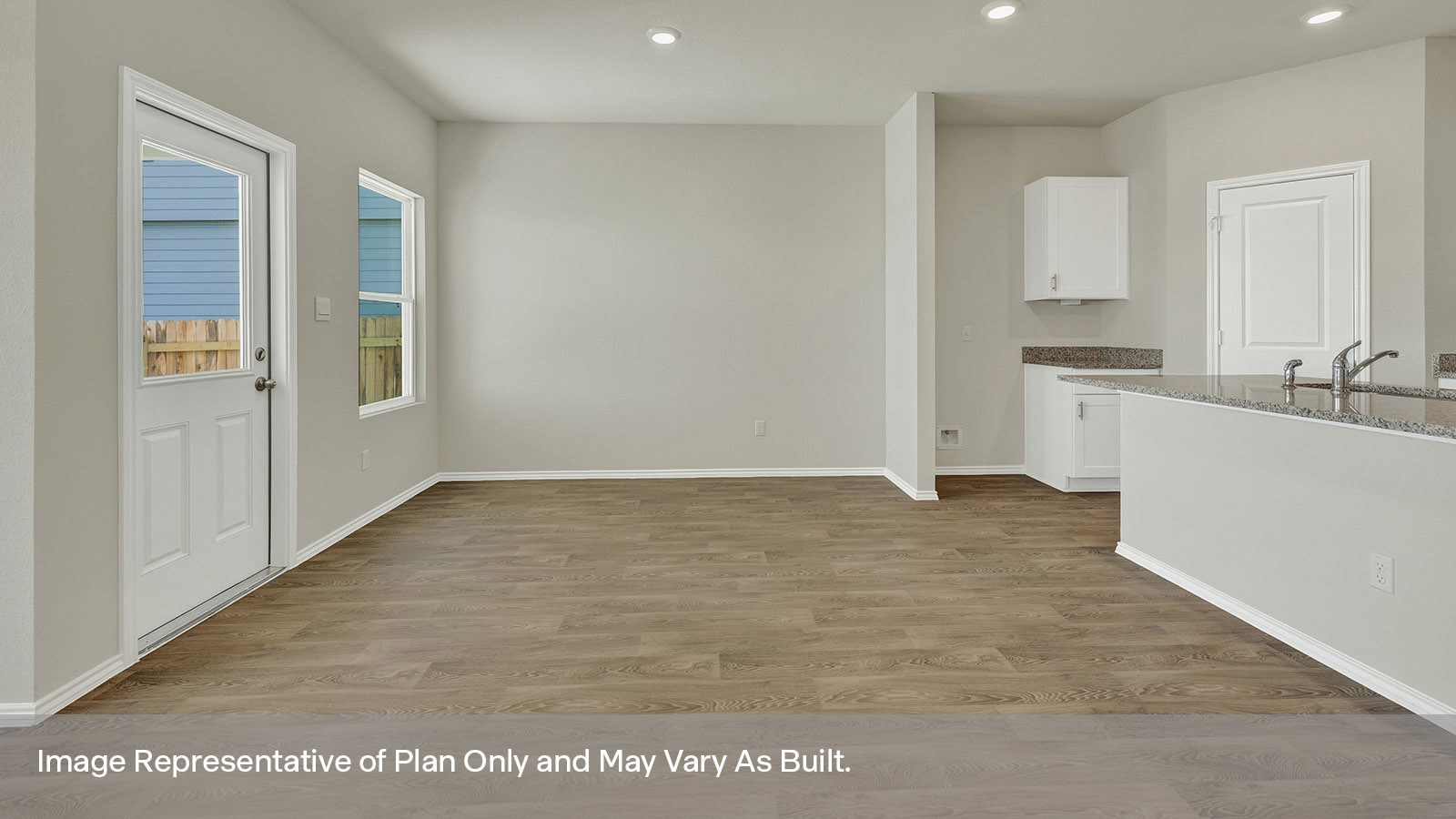 Dining room opening to the kitchen and entry hallway.