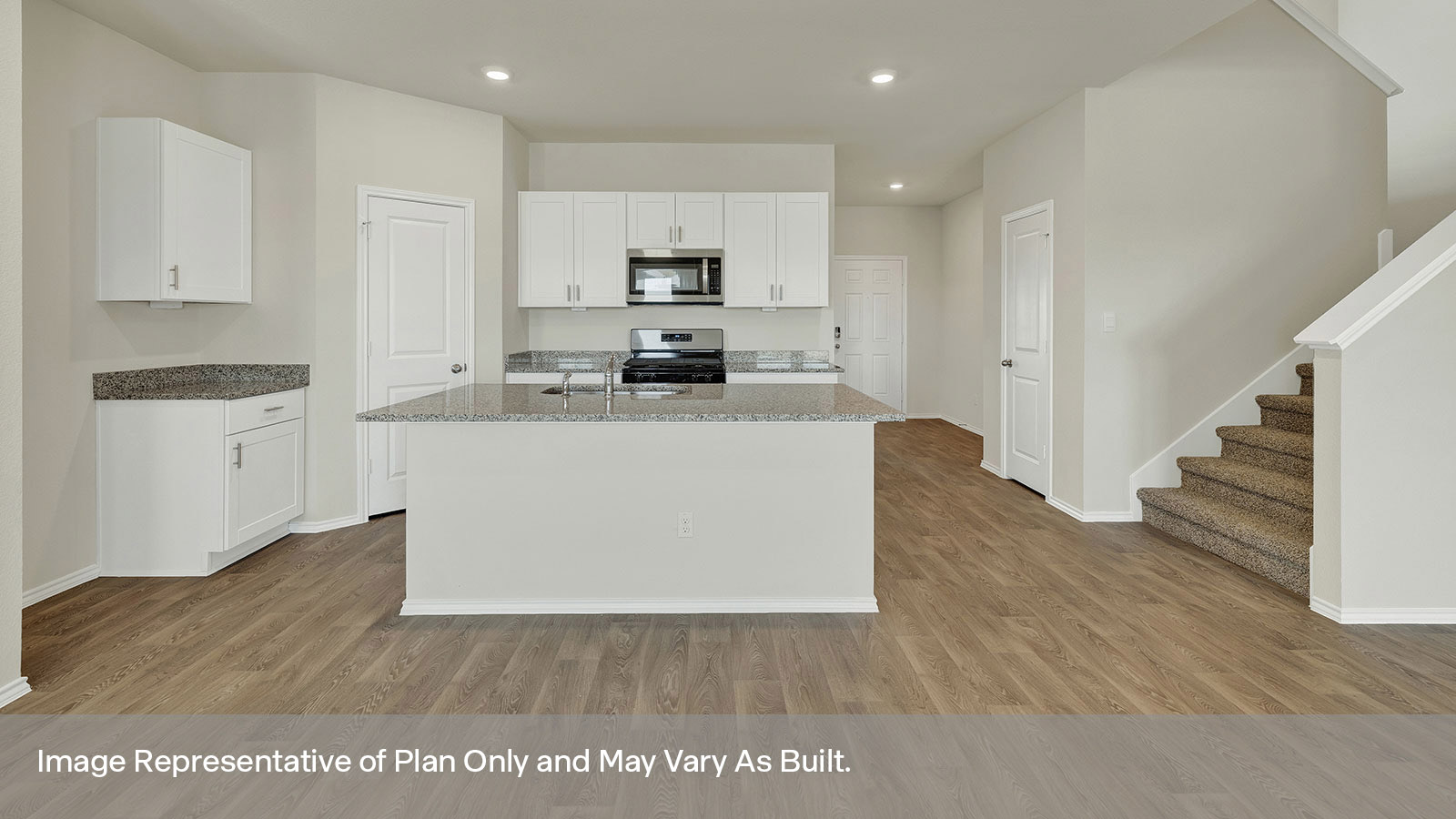 Kichen with kitchen island and stainless steel appliances.