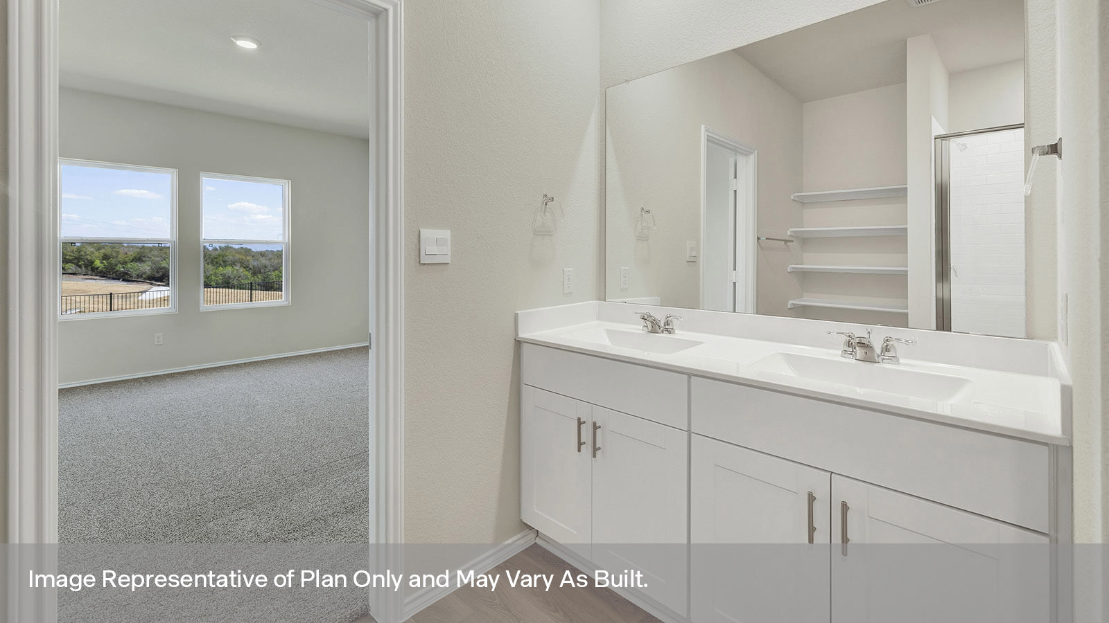 Main bathroom with double sink vanity and white cabinet, walk-in shower, and closet entry.