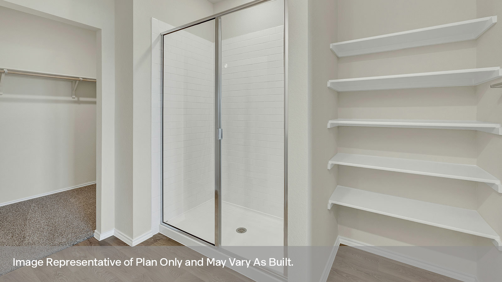 Main bathroom with double sink vanity and white cabinet, walk-in shower, and closet entry.