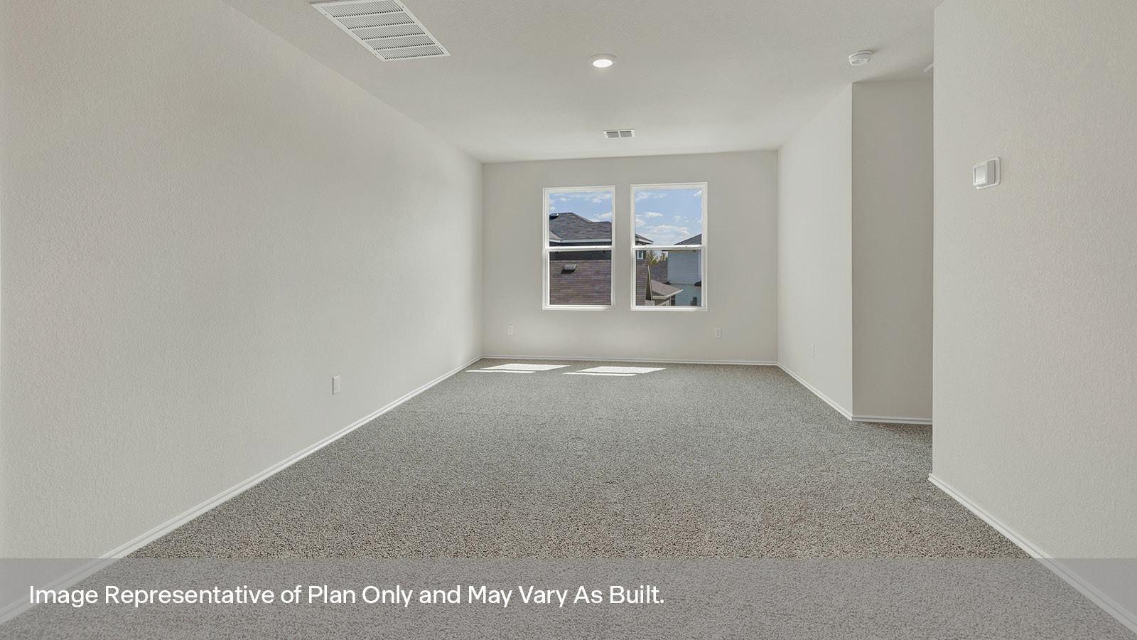 Loft with carpeting and two windows.