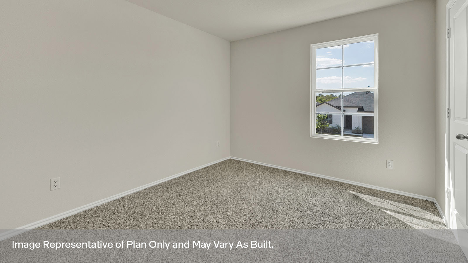 Bedroom with carpeting and one window.