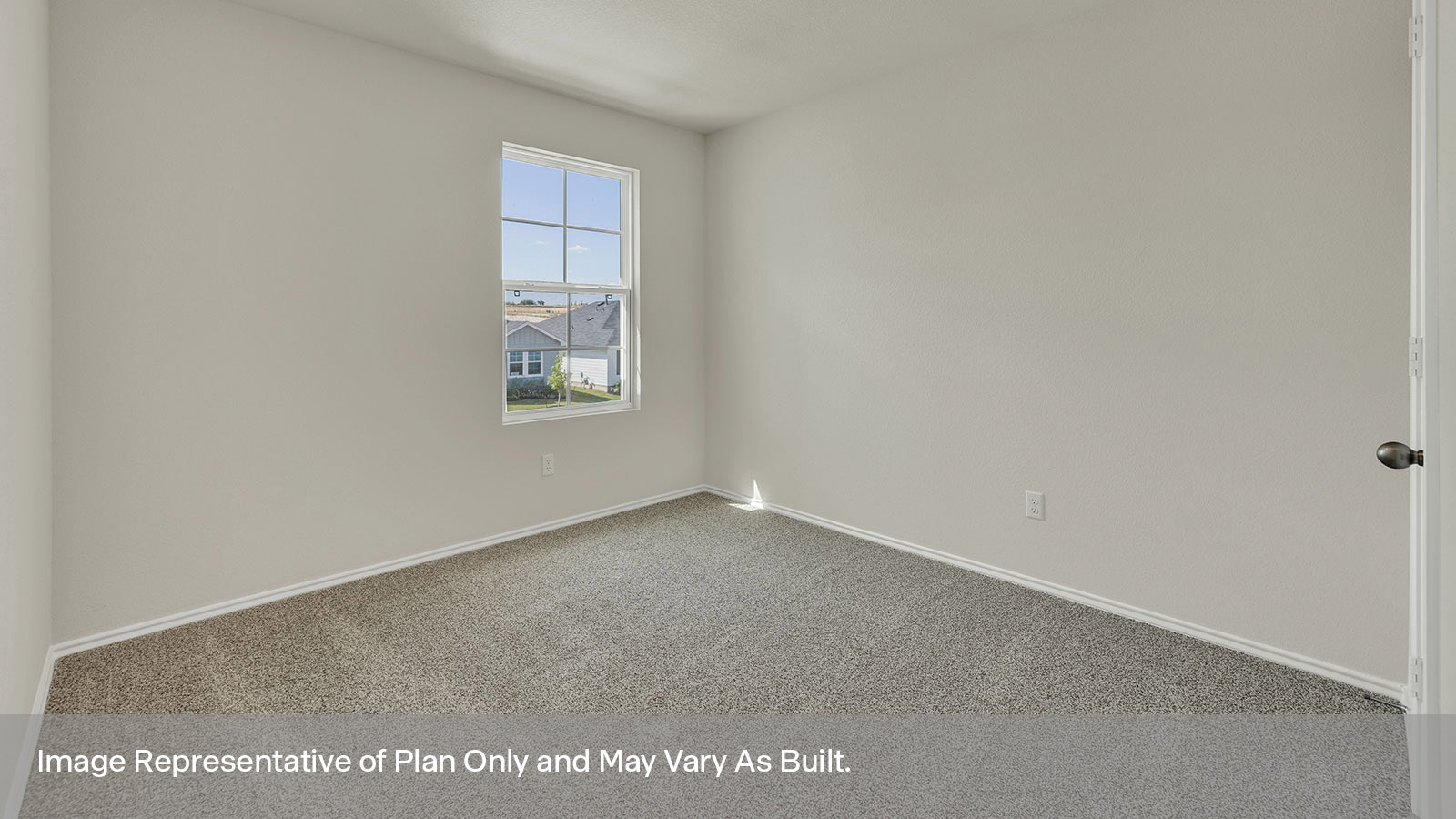 Bedroom with carpeting and one window.