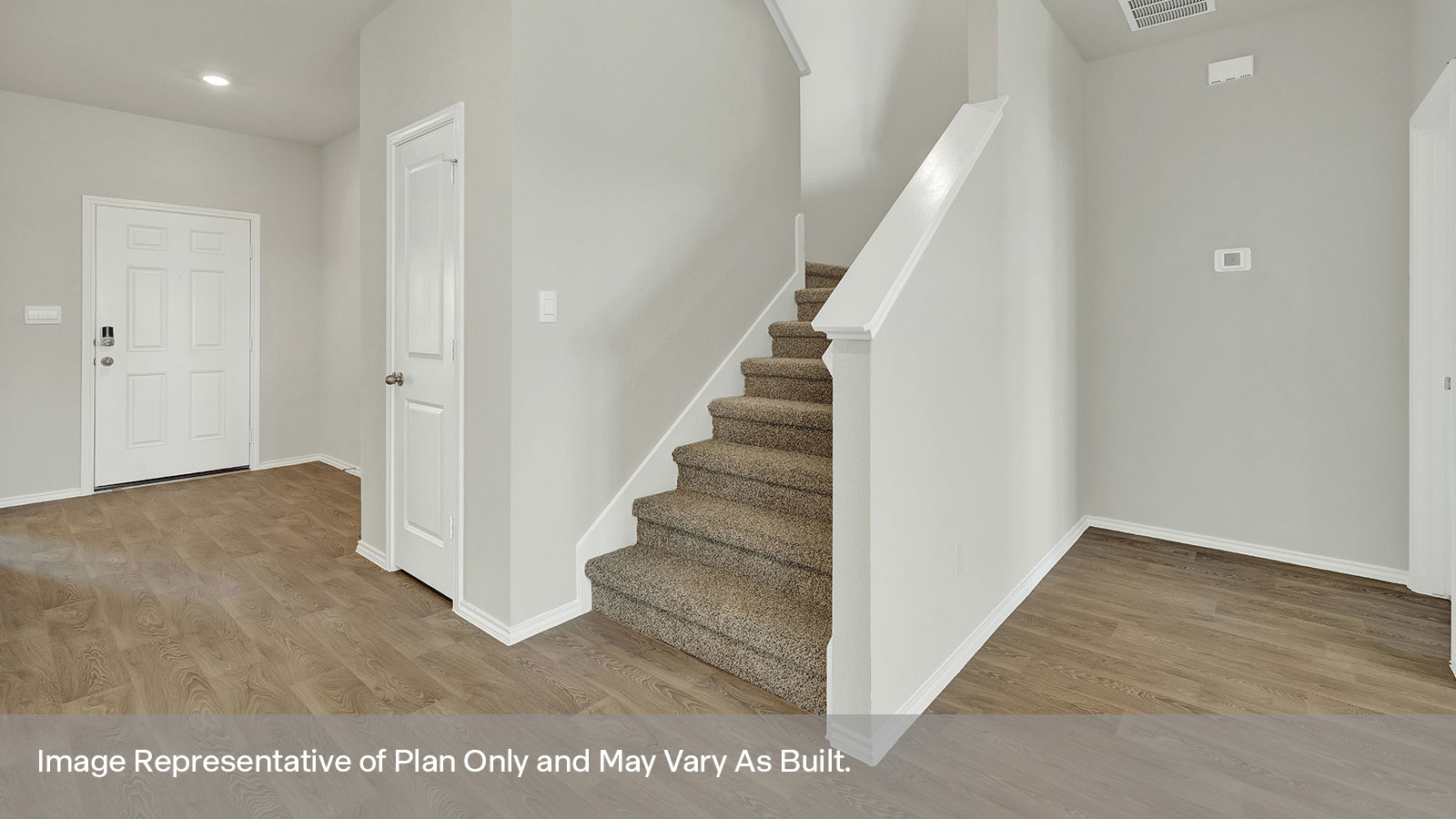 Entryway hallway entry with front door.