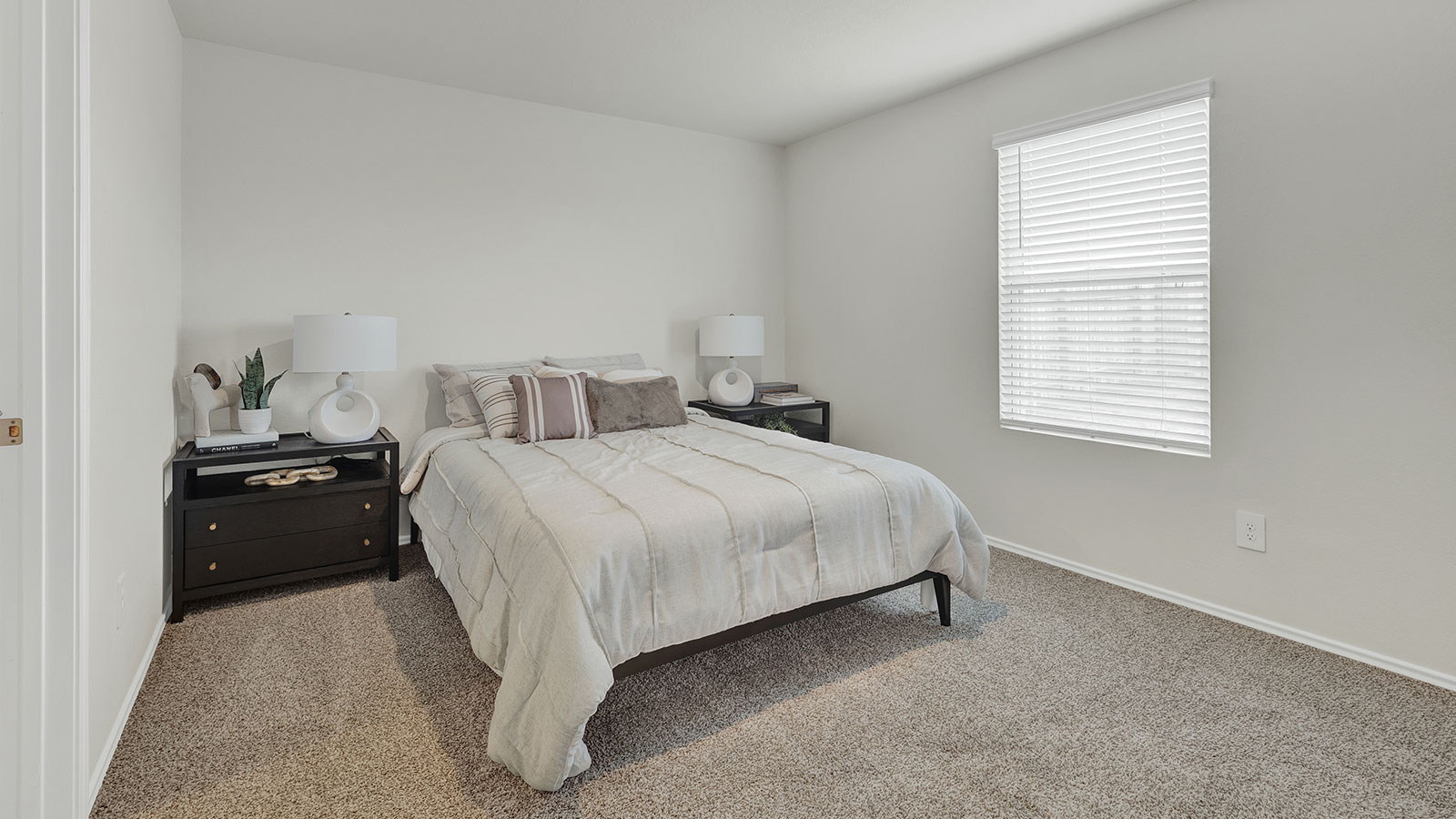 Satged bed 1 with bed frame and night stands.