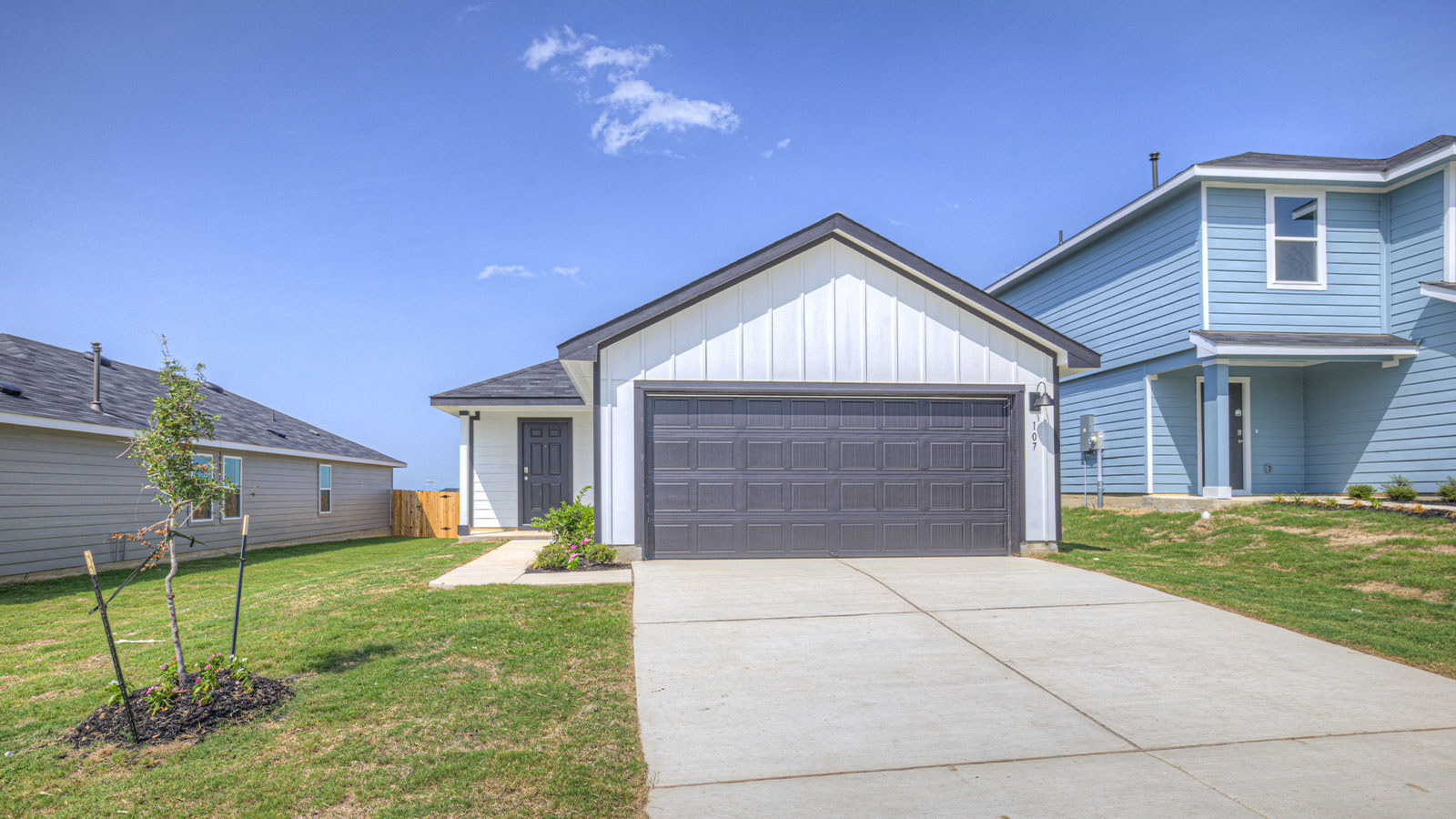Siding Exterior, Garage Forward with a wrap around Sidewalk