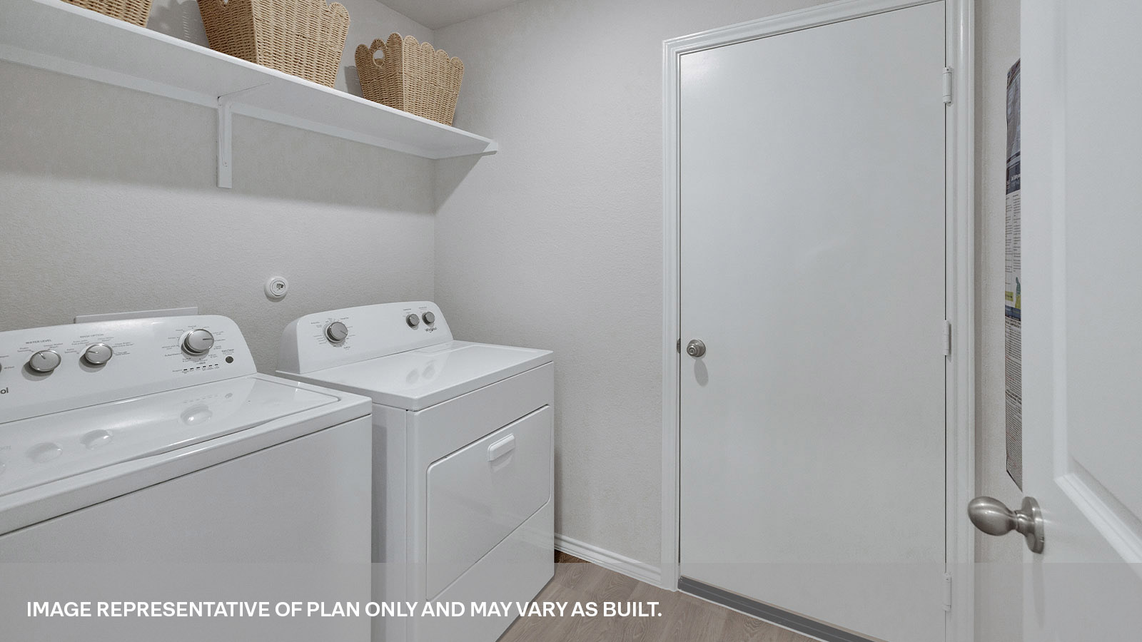 Laundry room with washer/dryer connections and wooden shelving.