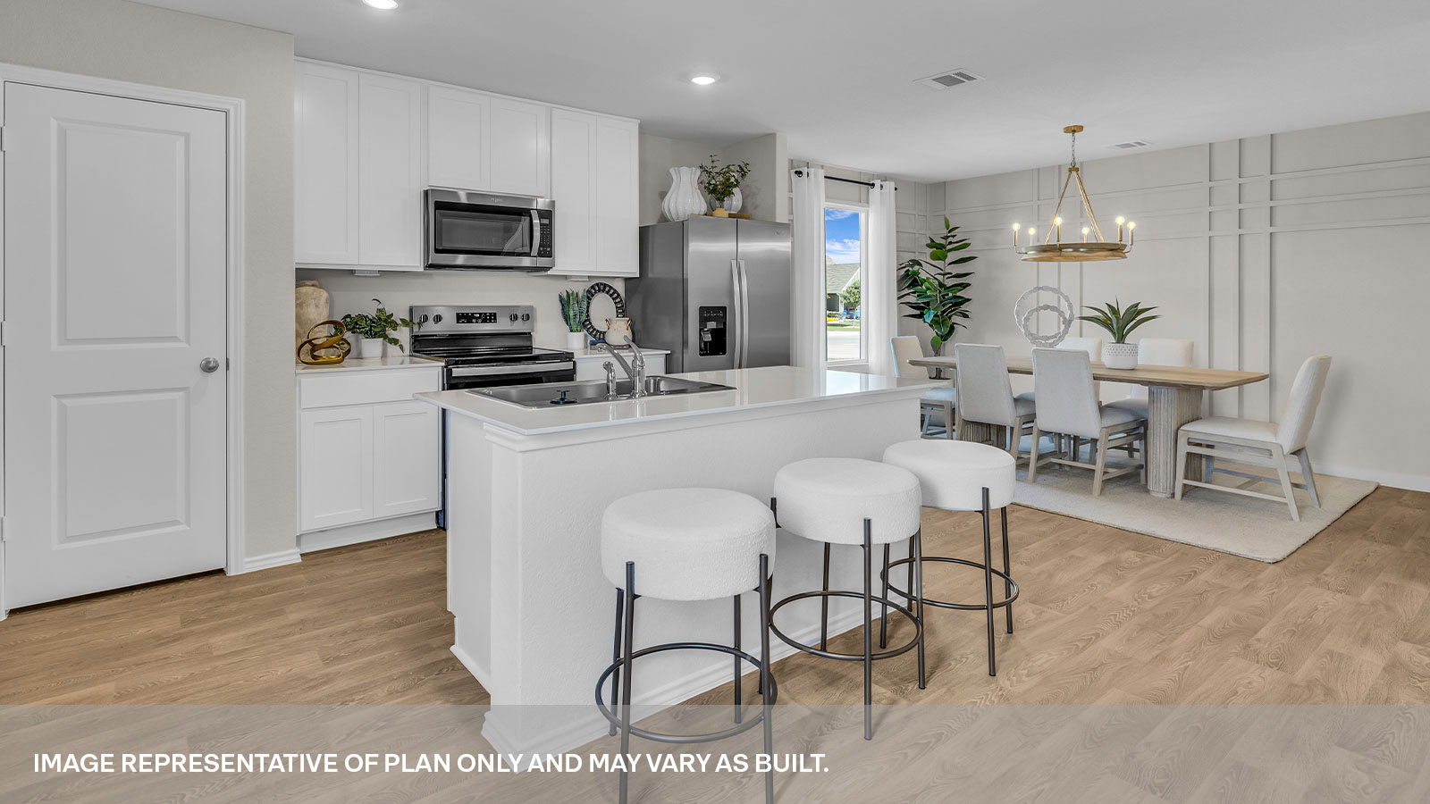 Kitchen with kitchen island and stainless steel appliances.