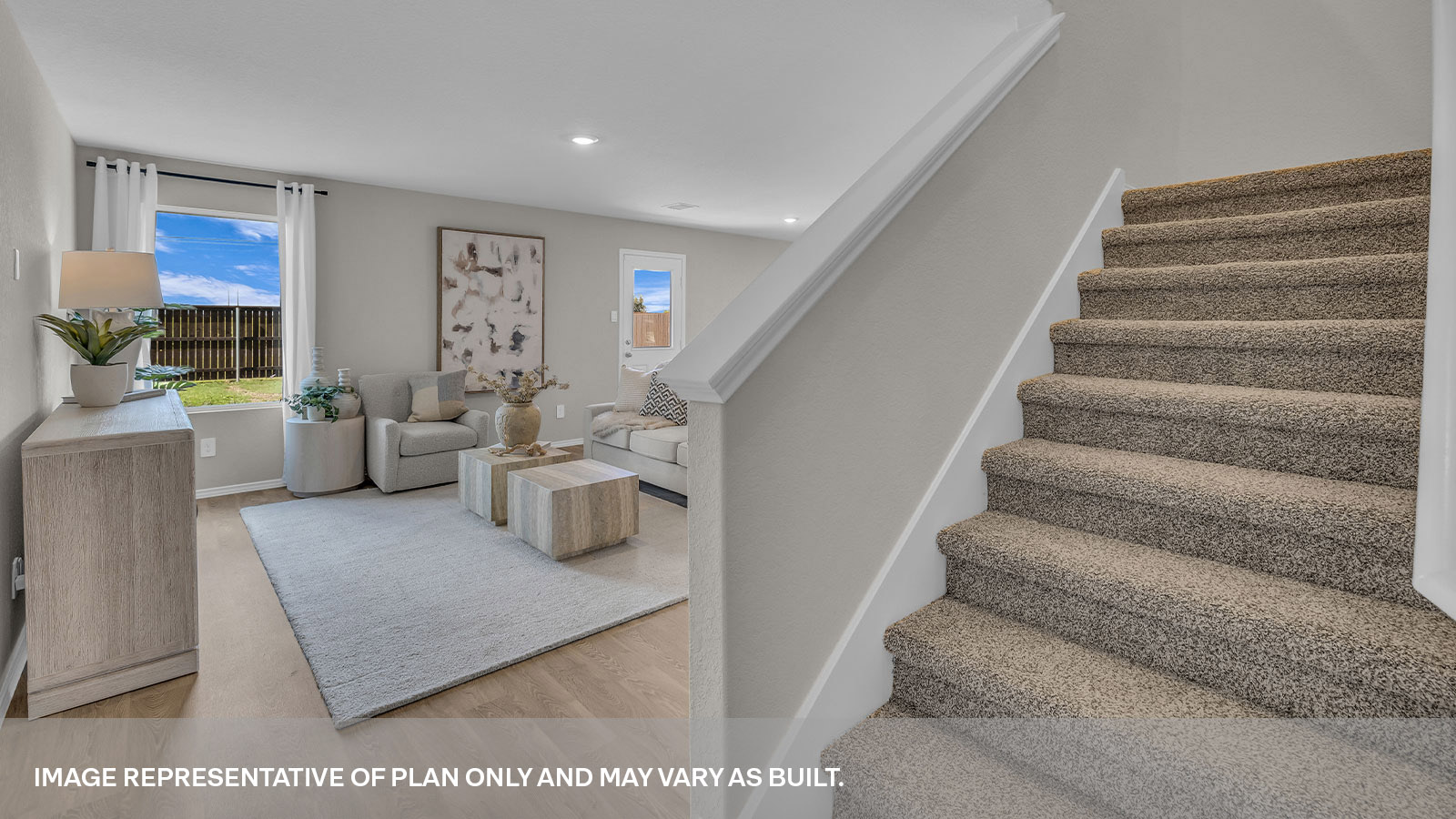 Entry hallway showing staircase and entering the living room.
