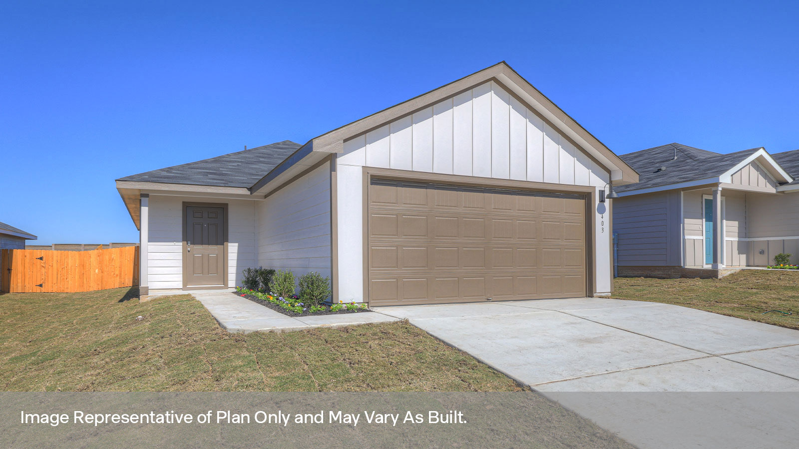 Single-story farmhouse with 2 car garage.
