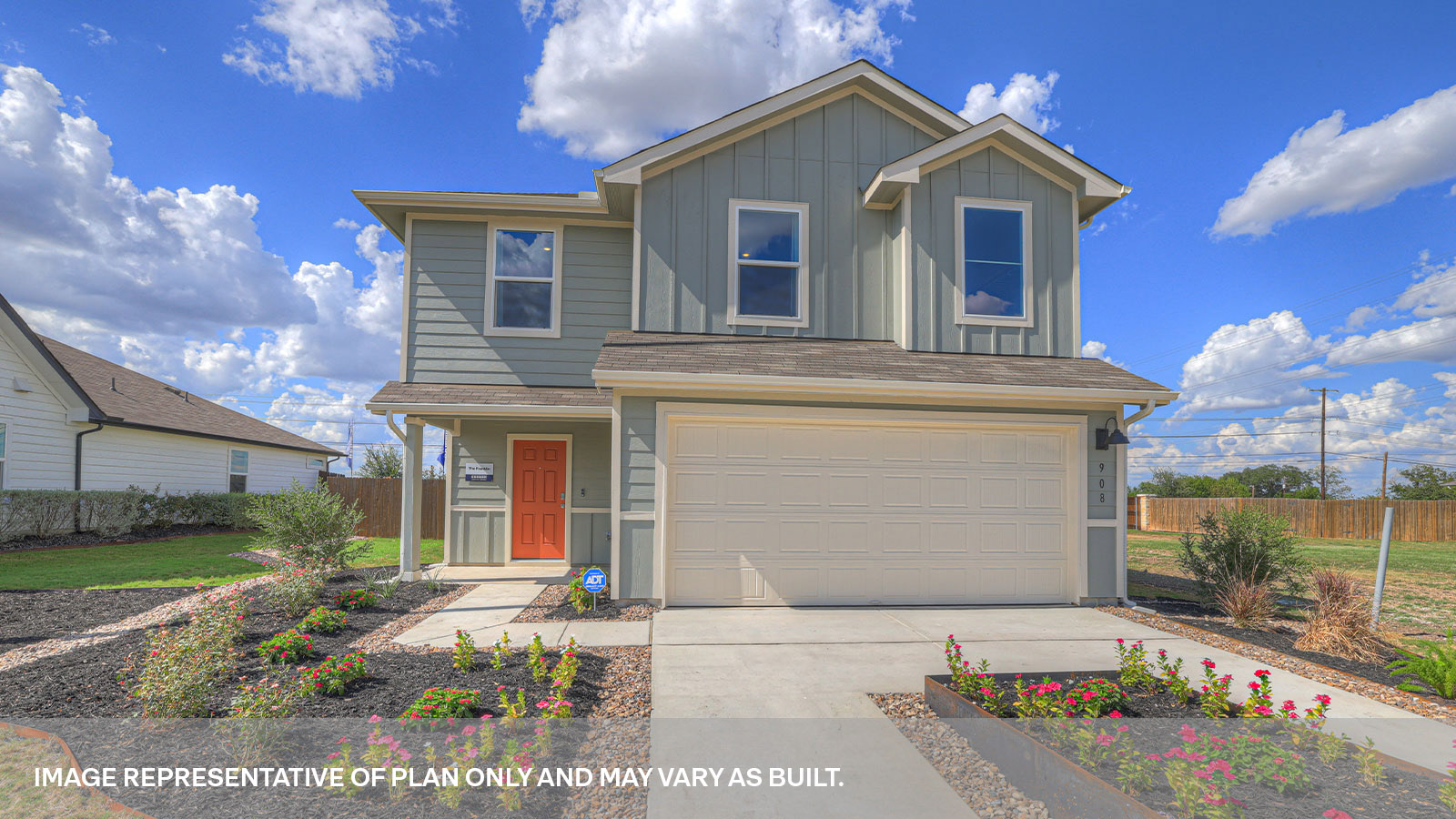 Two-story farmhouse exterior with 2 car garage.