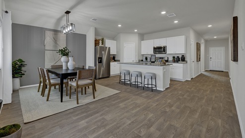 Dining room, kitchen, and entry hallway.
