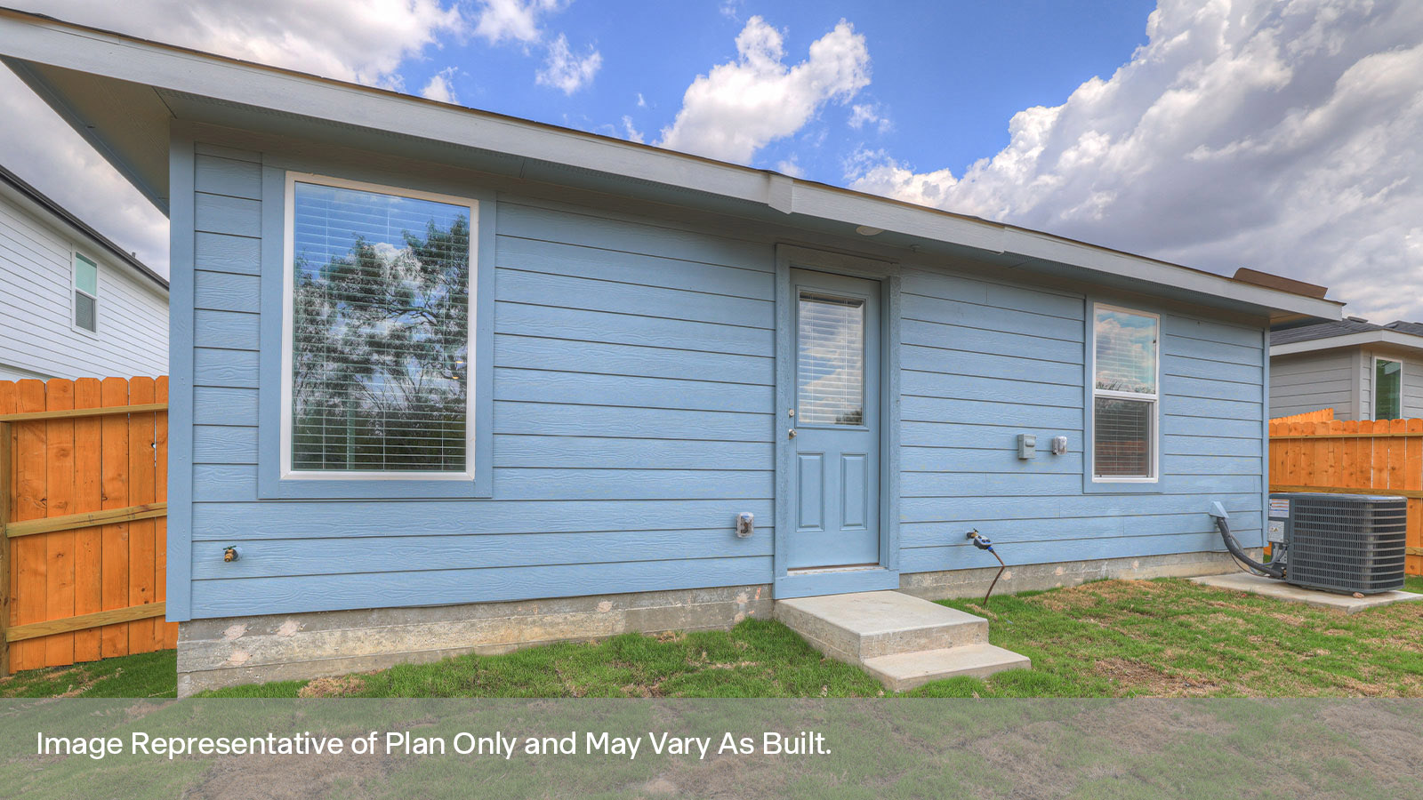 Backyard with sod and privacy fence.