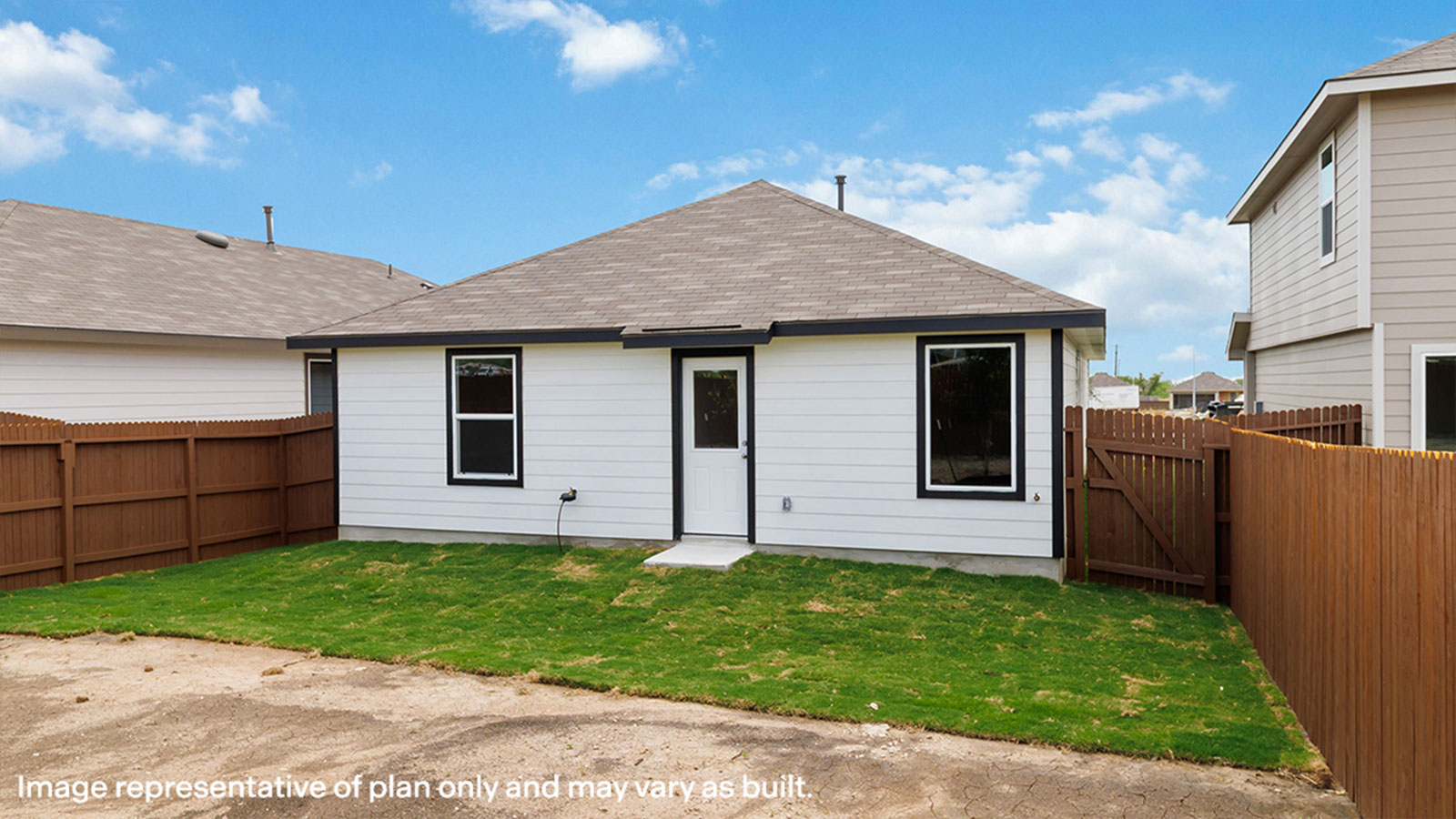 Backyard with sod and privacy fence.