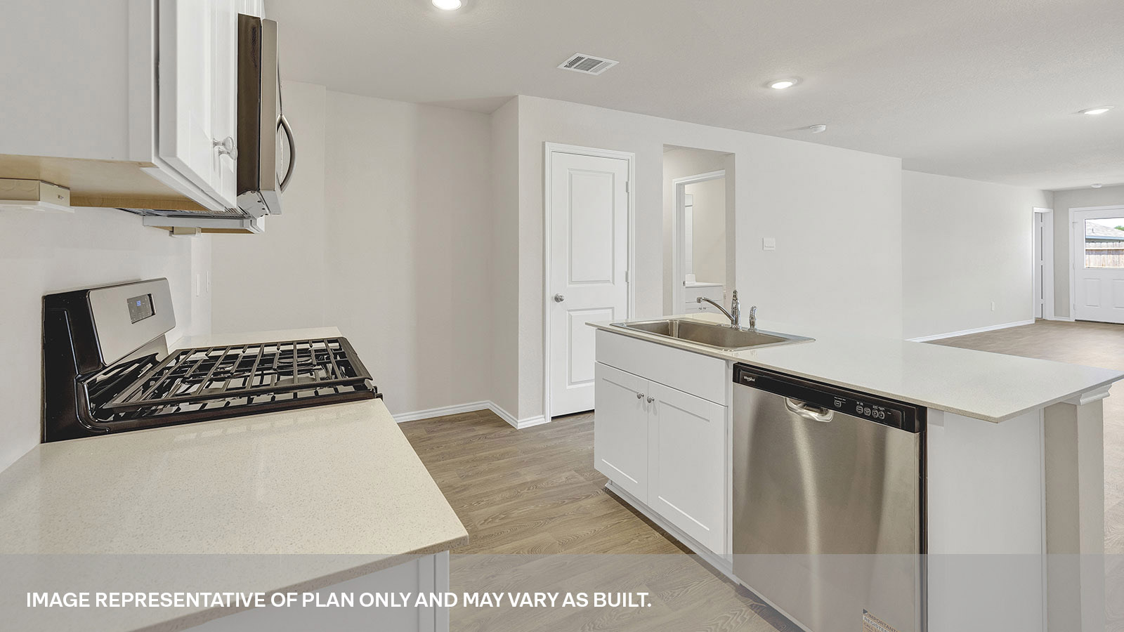 Kitchen with kitchen island and quartz countertops.