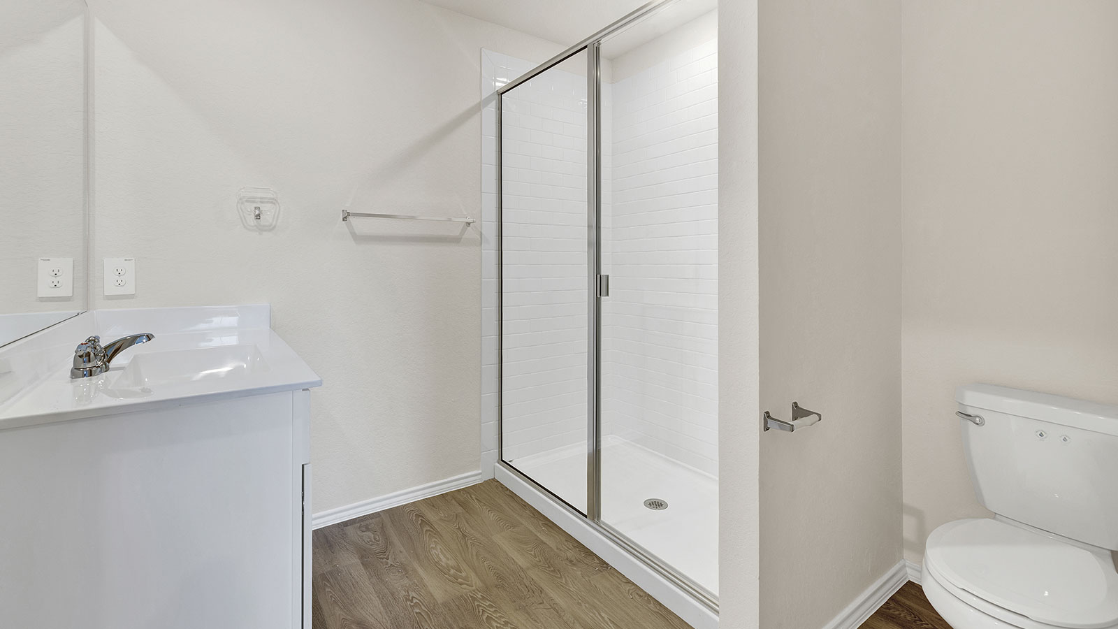 Main bathroom with single sink vanity and closet entry.