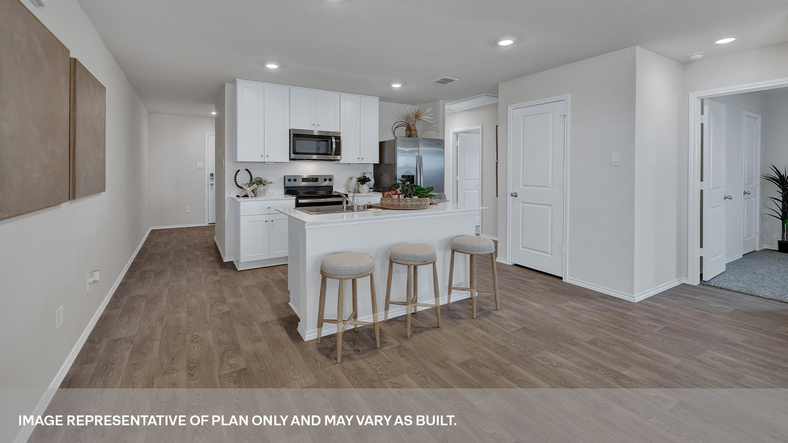 Kitchen with kitchen island and white cabinets.