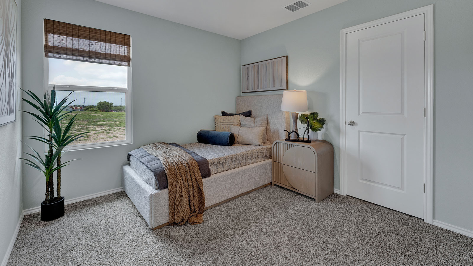 Bedroom with carpeting and one window.
