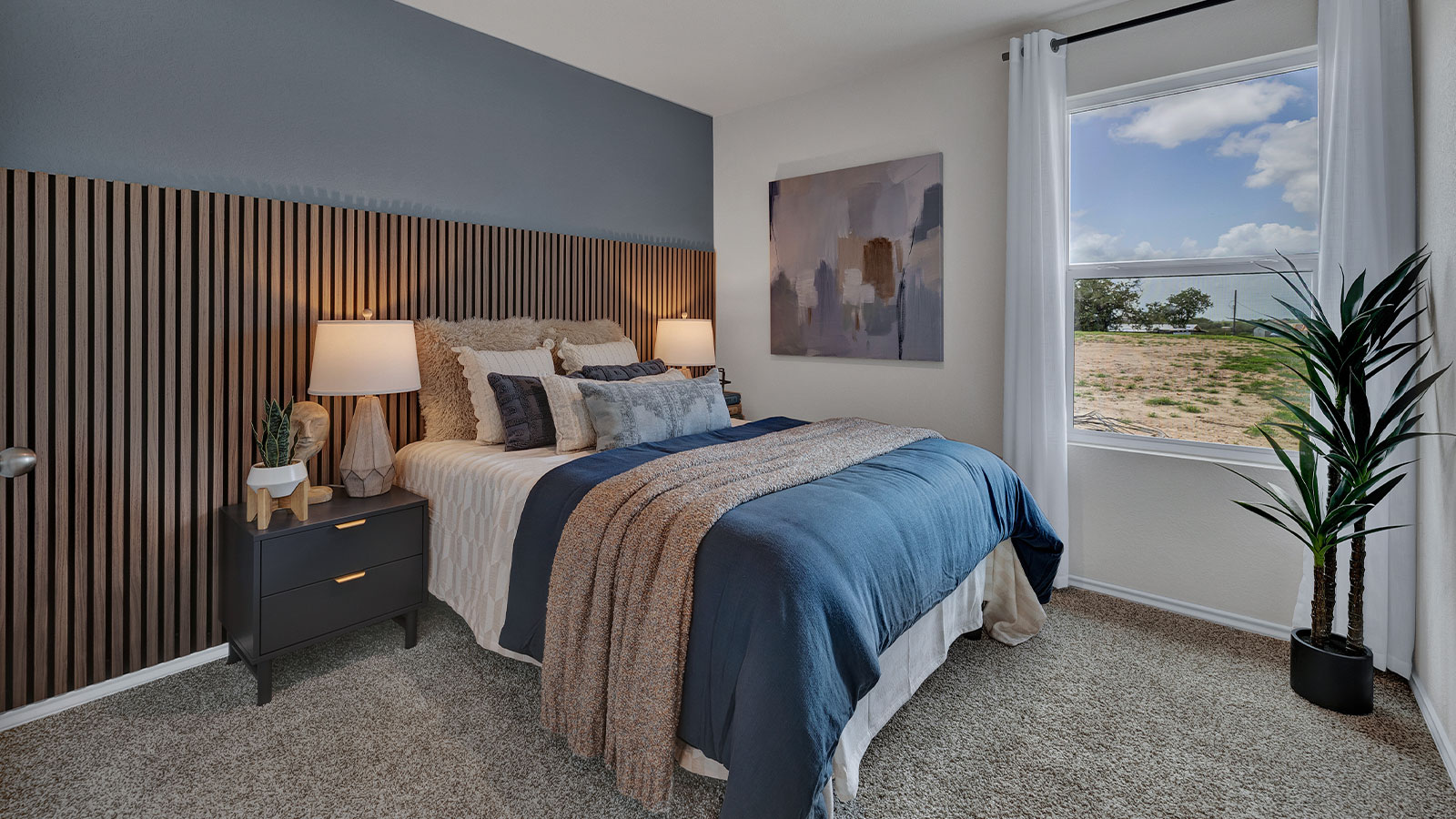 Bedroom with carpeting and one window.