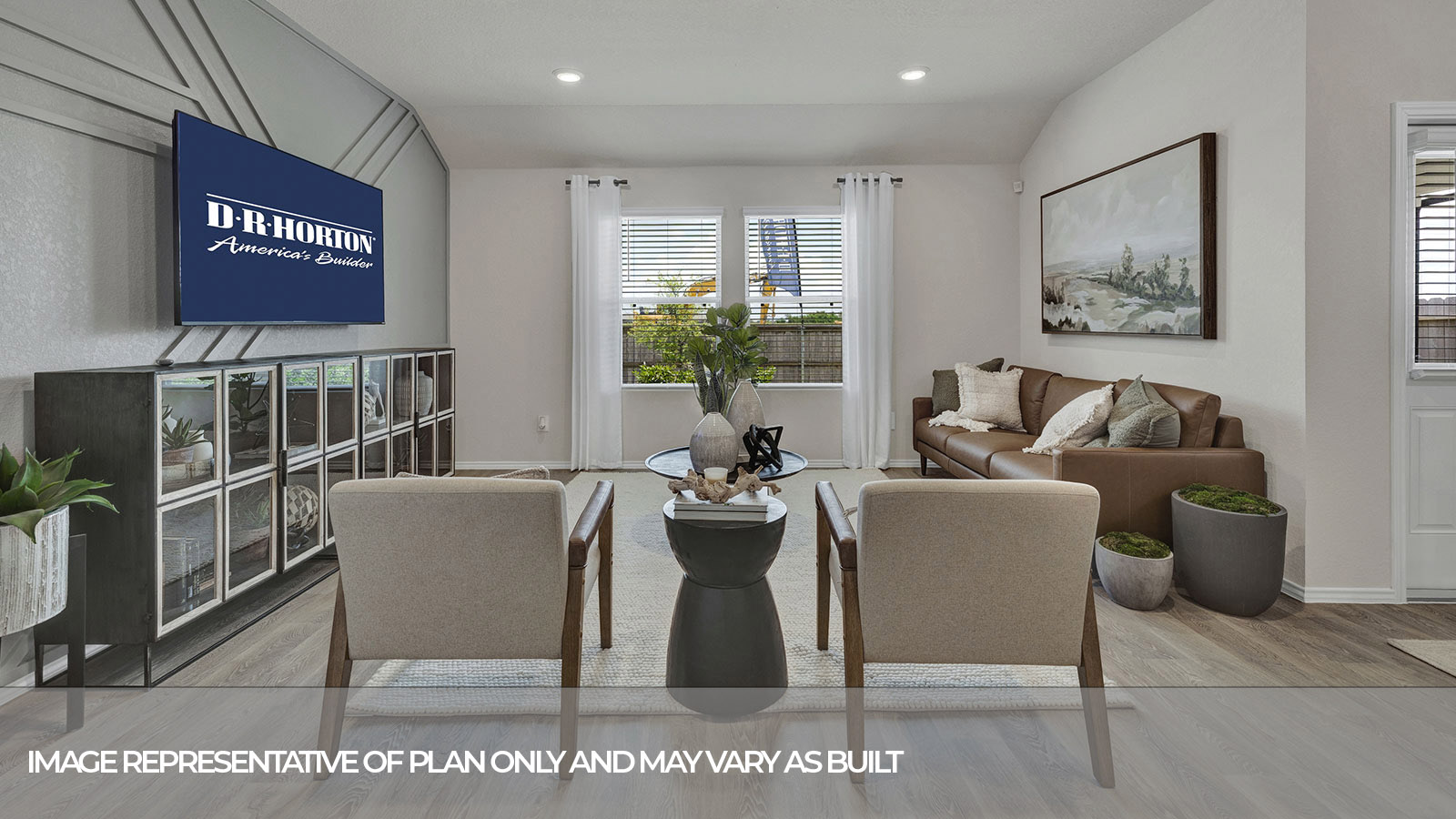 Living room with vinyl flooring and two windows.