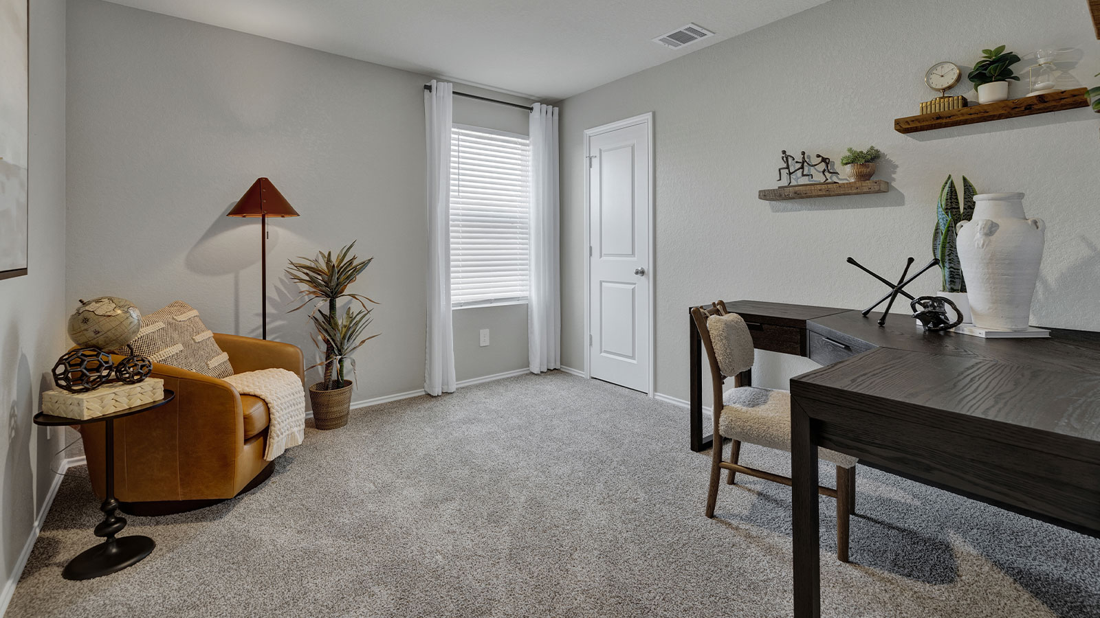 Bedroom with carpeting and one window.