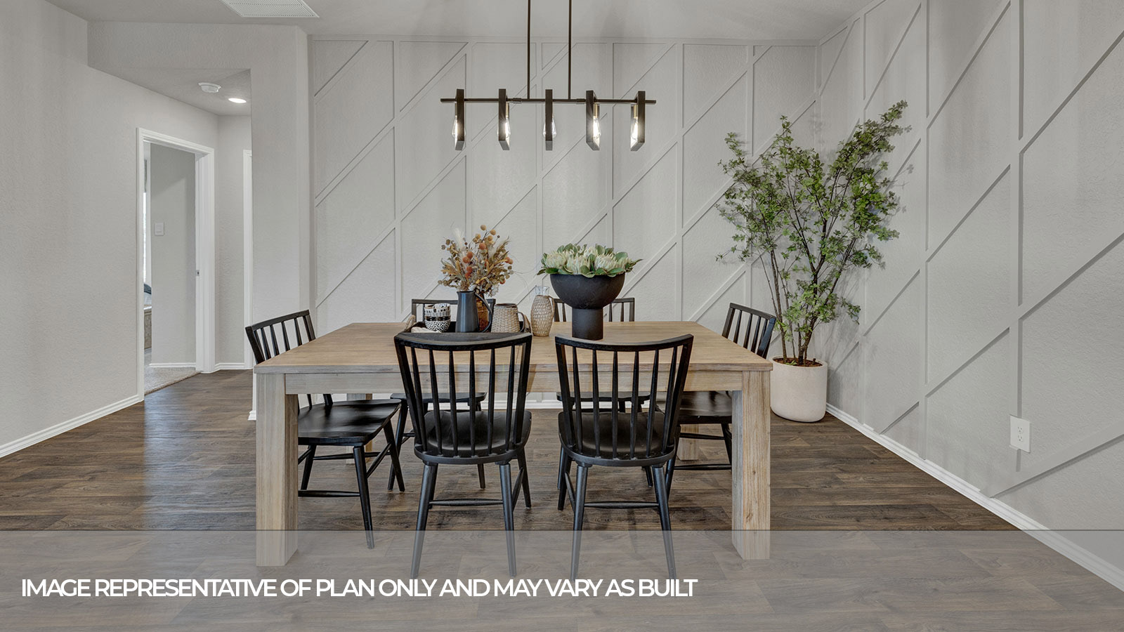 Dining room with vinyl flooring and bedroom hallway.